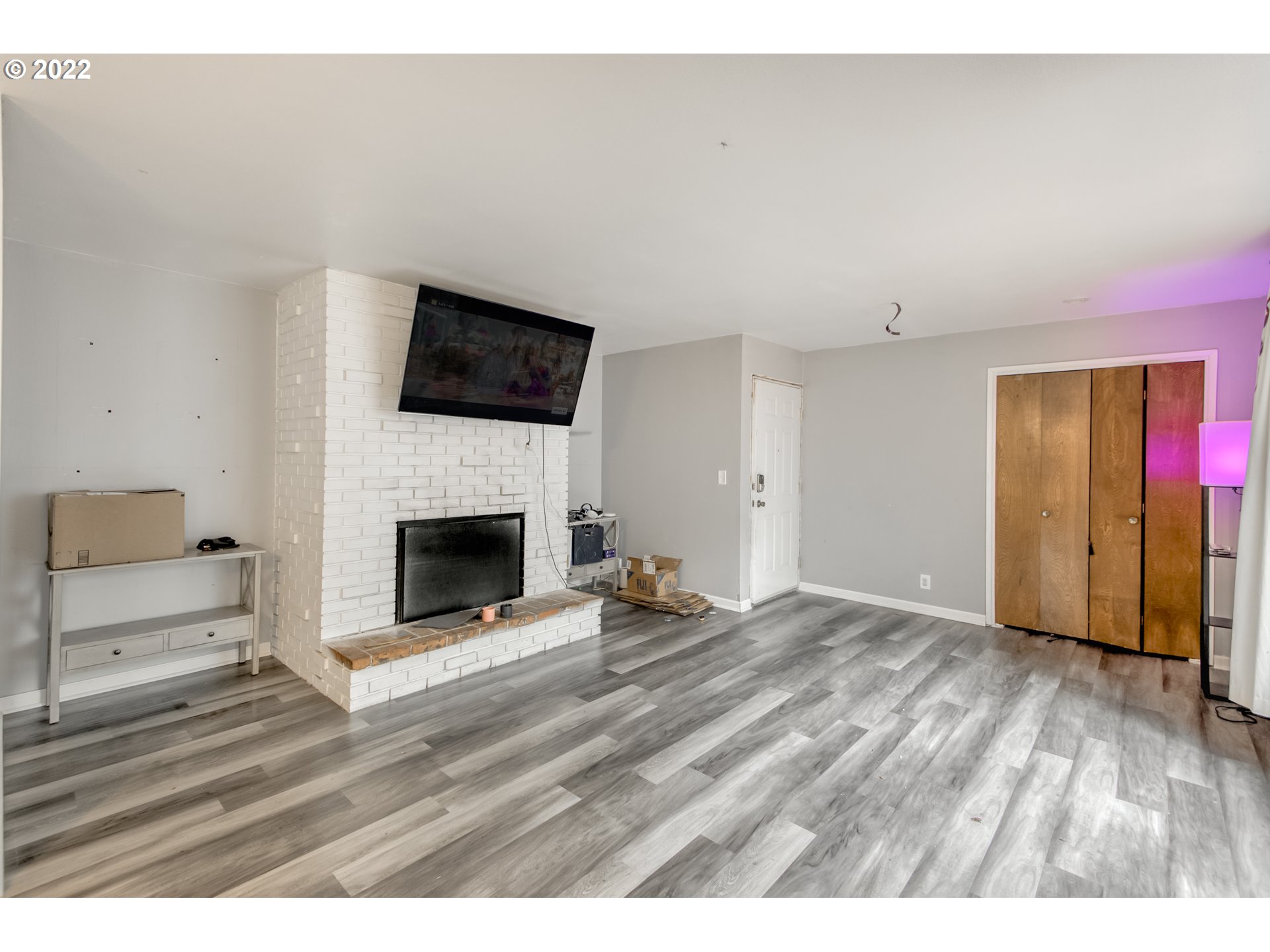 8960 Southwest Cashmur Lane Portland, OR 97225 - Photo 4 of 19 a view of a livingroom with furniture a fireplace and wooden floor