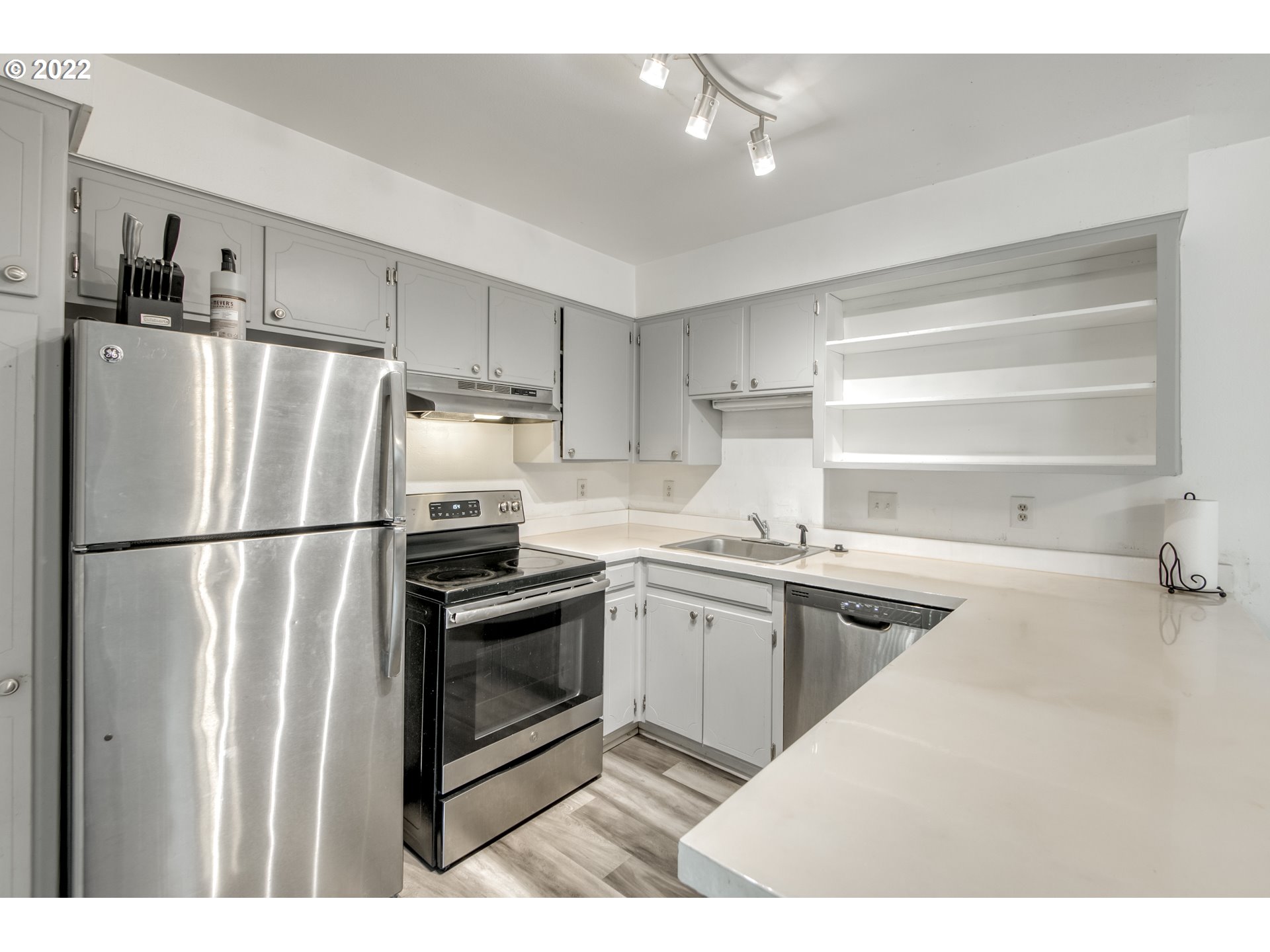 8960 Southwest Cashmur Lane Portland, OR 97225 - Photo 6 of 19 a kitchen with a refrigerator sink and stove