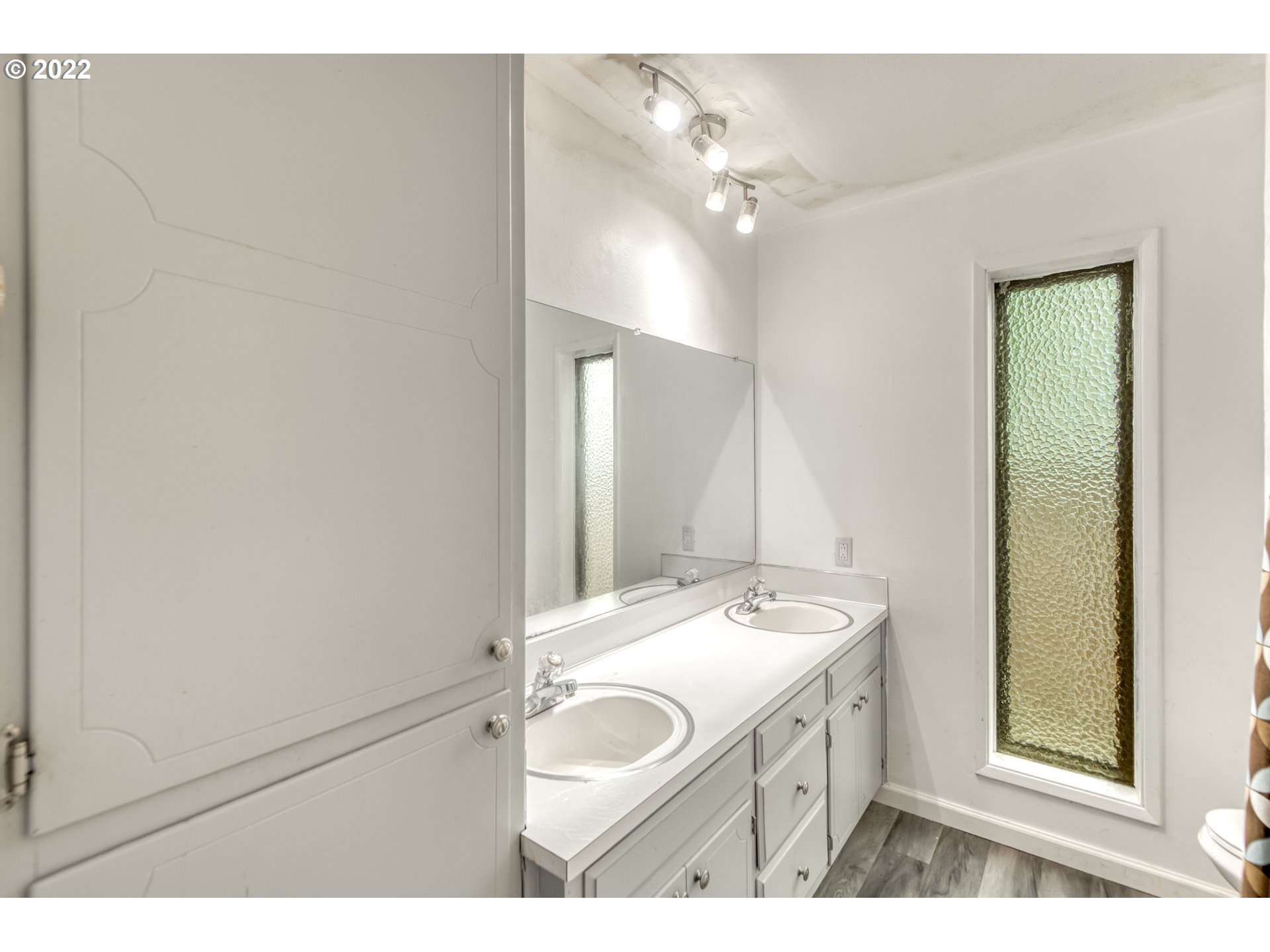 8960 Southwest Cashmur Lane Portland, OR 97225 - Photo 10 of 19 a bathroom with a sink and a mirror