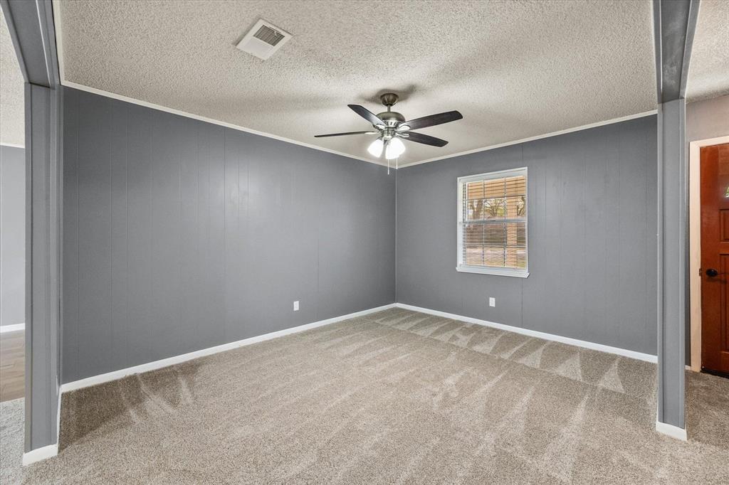 536 Robindale Lane Fairfield, TX 75840 - Photo 2 of 38 an empty room with windows and fan