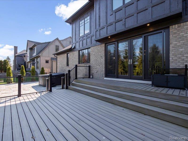 3824 Poppleton Street Troy, MI 48084 - Photo 49 of 51 Wooden deck featuring a hot tub, french doors, and a residential view