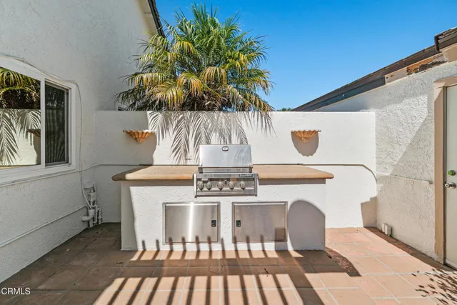 a view of a dining room with furniture and a chandelier
