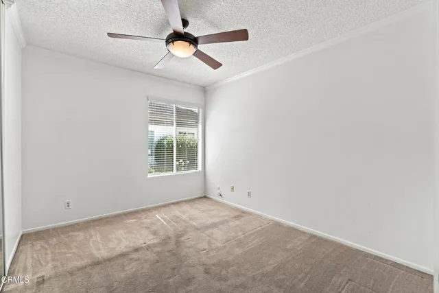 a view of empty room with windows