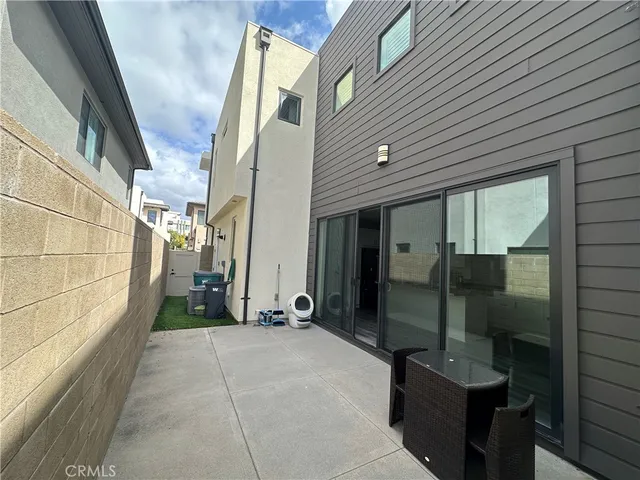 a view of a brick house with a potted plant on a wall