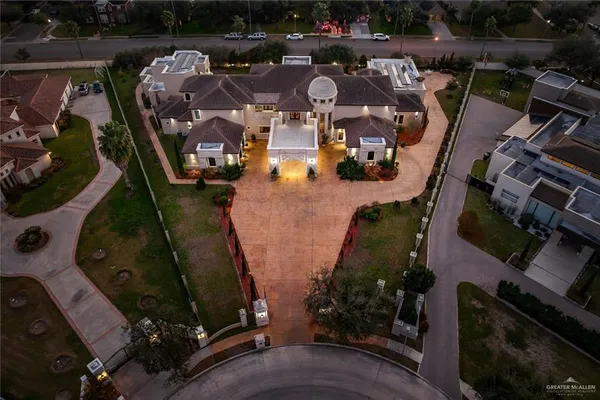 an aerial view of houses with outdoor space