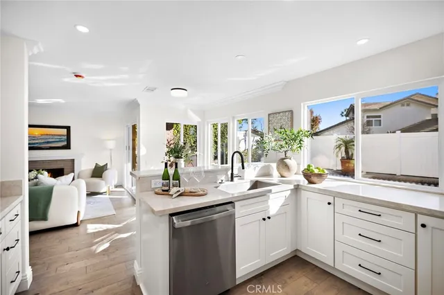 a kitchen with a sink and large window