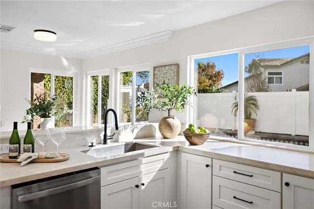 a kitchen with a sink stove and microwave