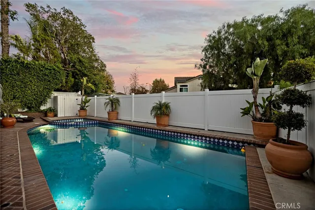 a view of a porch with furniture and a grill