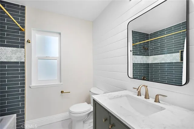 an aerial view of a house with outdoor space