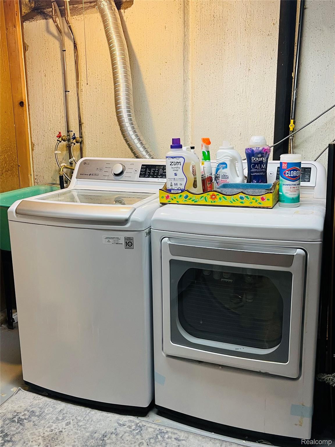 488 Welch Road Northville, MI 48167 - Photo 21 of 22 Laundry area featuring a top-load washing machine, front-load dryer, and a utility sink