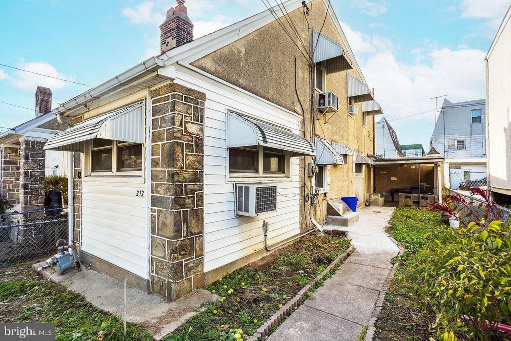 212 Heather Road Upper Darby, PA 19082 - Photo 2 of 28 a view of a house with a small garden