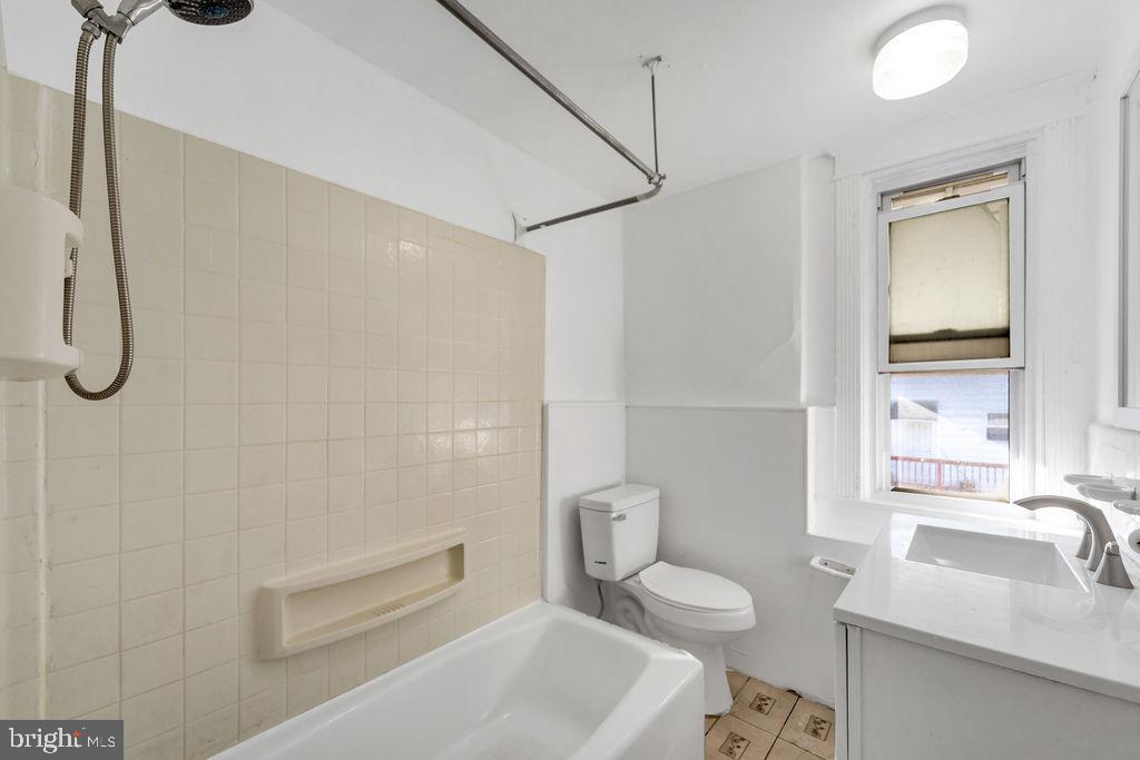 212 Heather Road Upper Darby, PA 19082 - Photo 23 of 28 a bathroom with a sink a toilet and shower