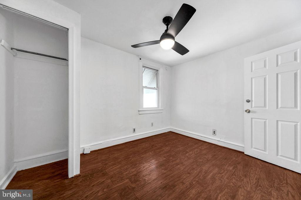 212 Heather Road Upper Darby, PA 19082 - Photo 25 of 28 a view of empty room with wooden floor and fan