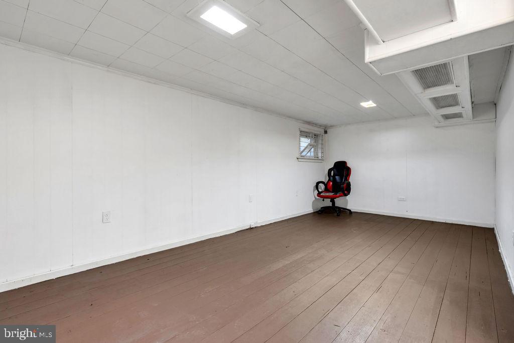 212 Heather Road Upper Darby, PA 19082 - Photo 26 of 28 a view of a room with wooden floor