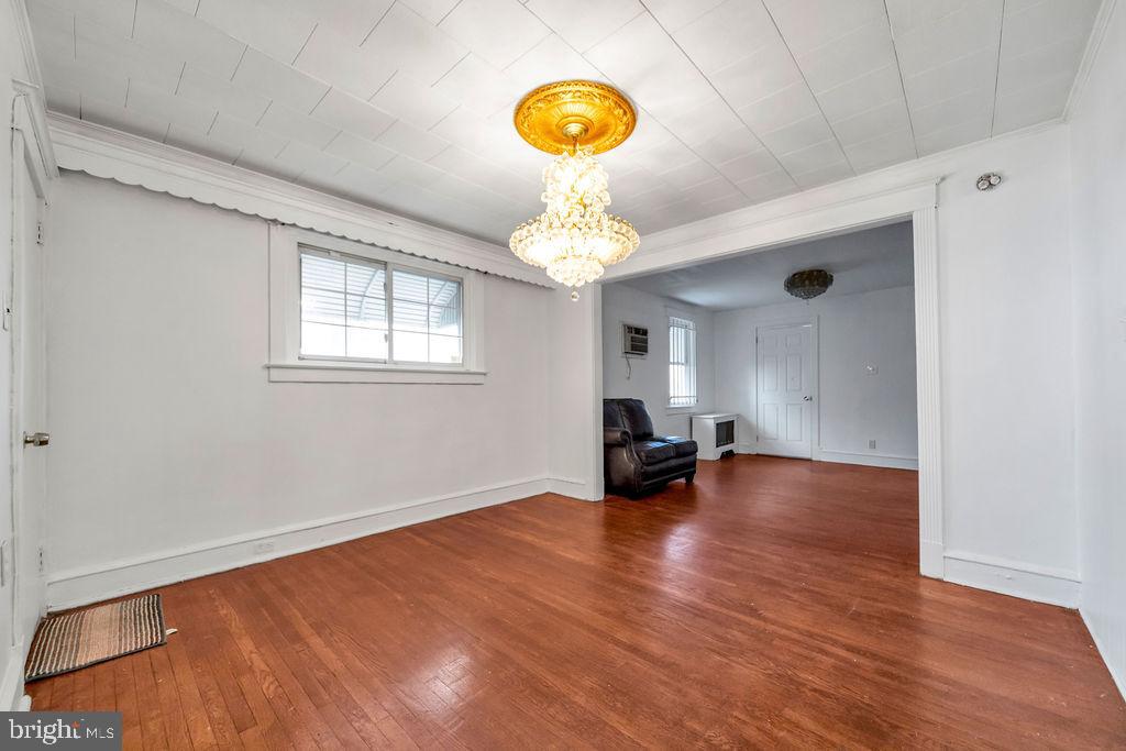 212 Heather Road Upper Darby, PA 19082 - Photo 9 of 28 a view of empty room with wooden floor