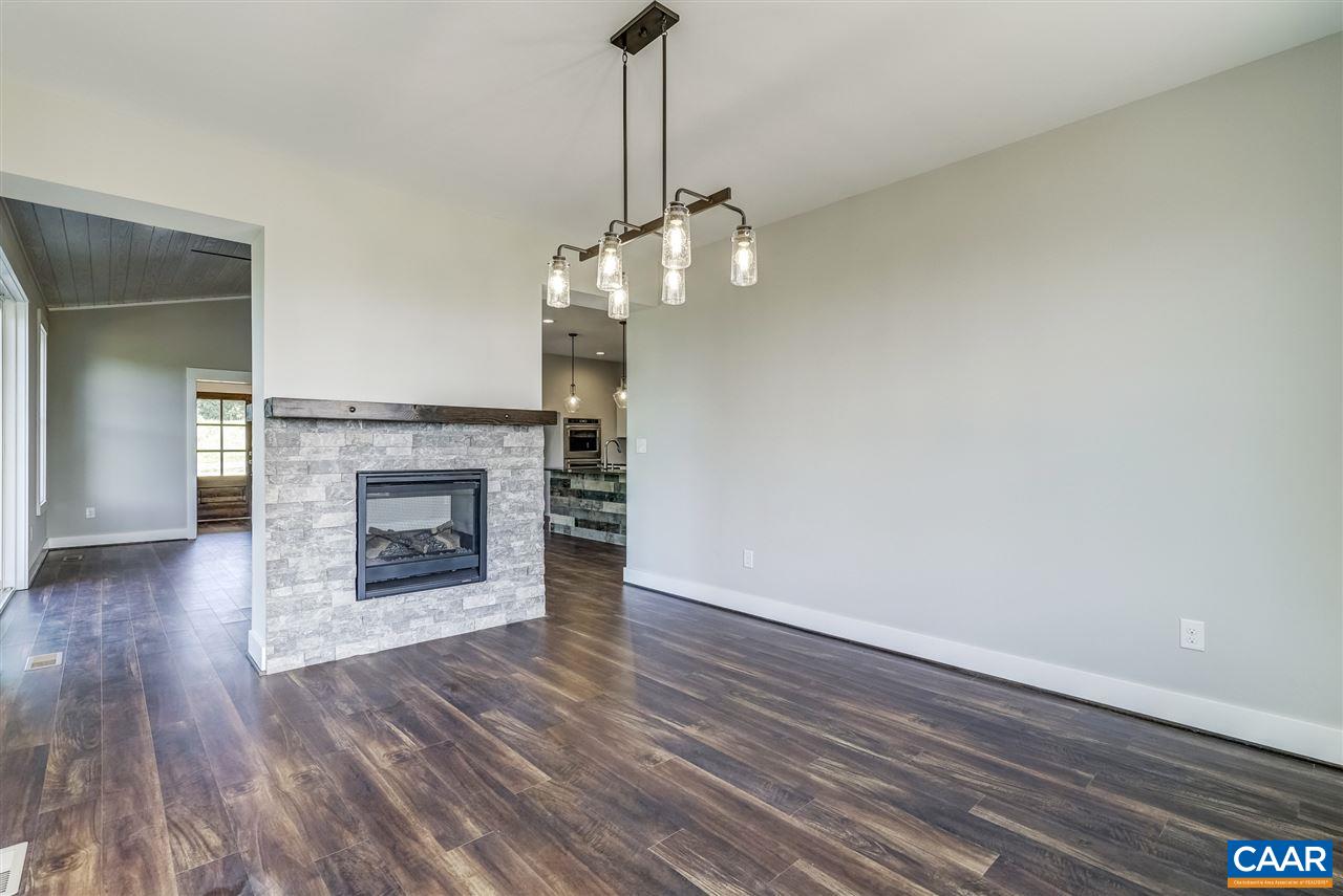 203 Guildford Farm Road Ruckersville, VA 22968 - Photo 25 of 50 a view of a livingroom with a fireplace and wooden floor