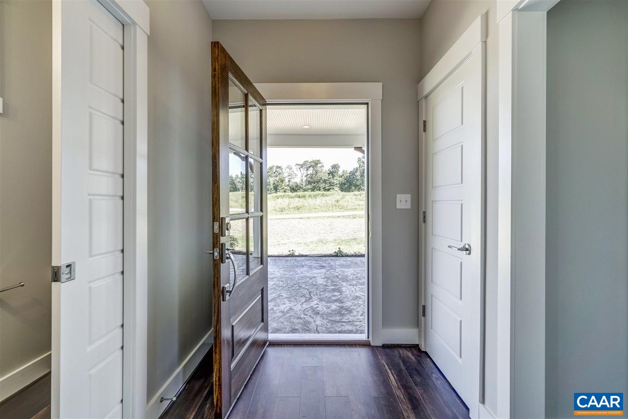 203 Guildford Farm Road Ruckersville, VA 22968 - Photo 6 of 50 a view of hallway with wooden floor and fan