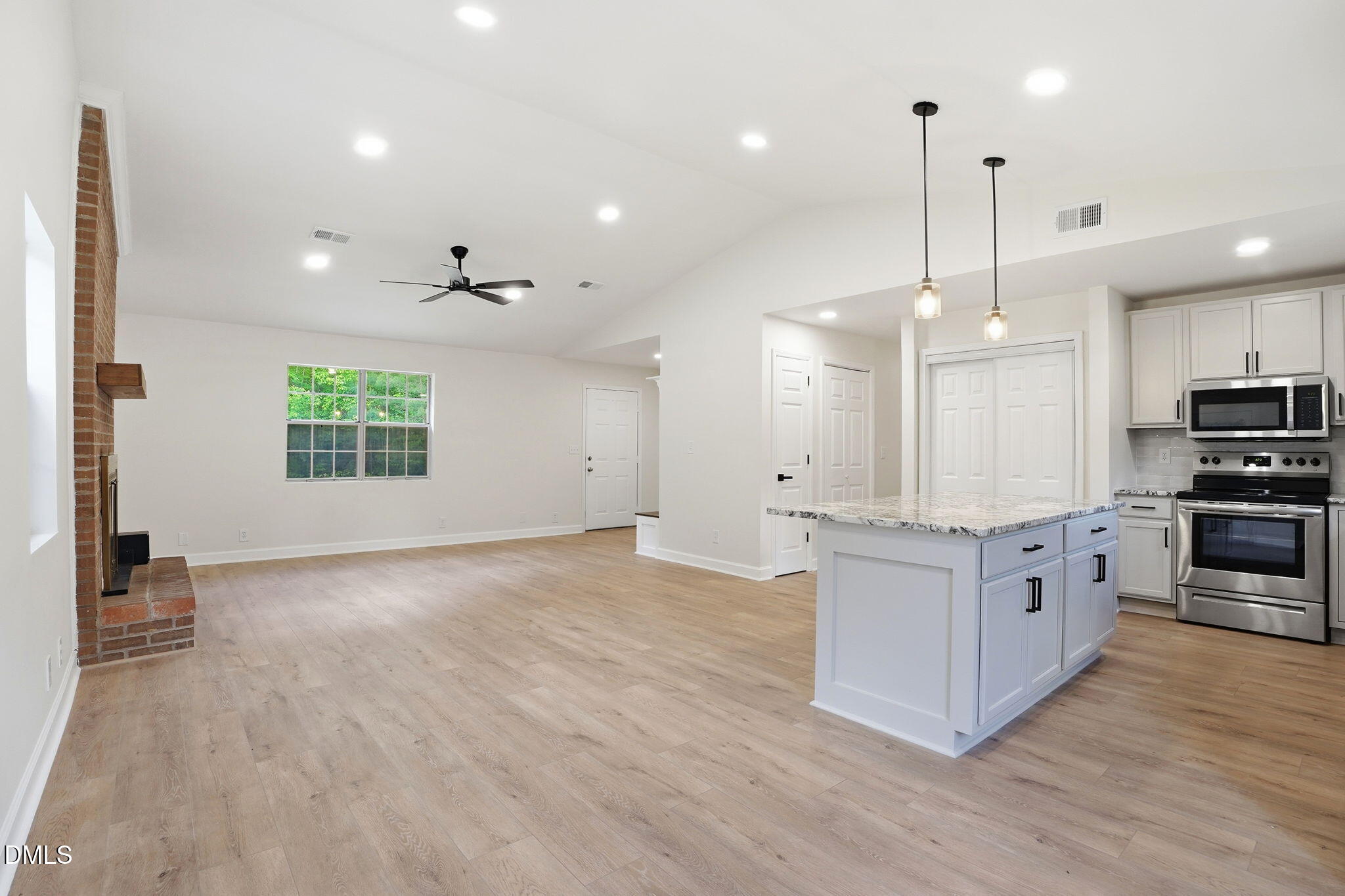 3602 Harrison Road Castalia, NC 27816 - Photo 28 of 48 a large kitchen with granite countertop a large counter top a sink stainless steel appliances and cabinets