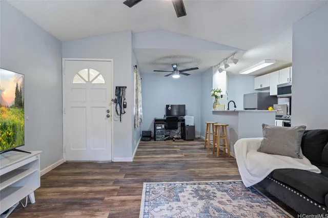 a living room with furniture and a fireplace