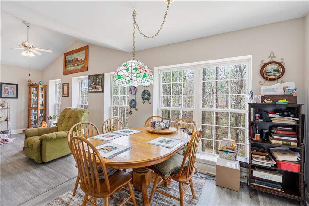 3724 Lexington Court Gainesville, GA 30504 - Photo 16 of 56 a view of a dining room with furniture and chandelier