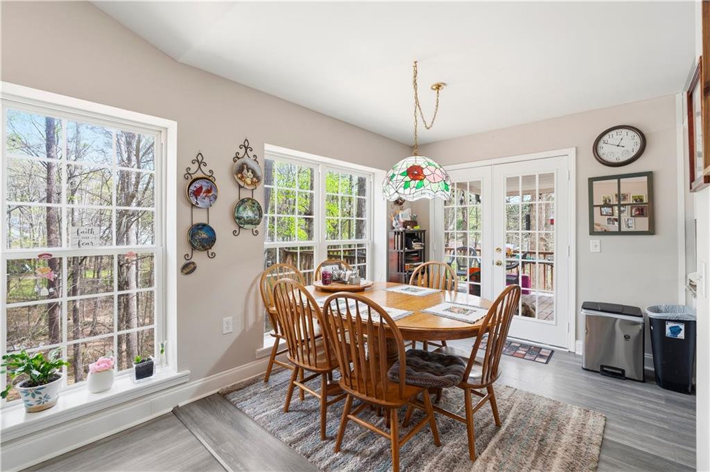 3724 Lexington Court Gainesville, GA 30504 - Photo 18 of 56 a view of a dining room with furniture window and wooden floor