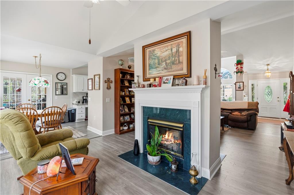 3724 Lexington Court Gainesville, GA 30504 - Photo 21 of 56 a living room with furniture and a fireplace