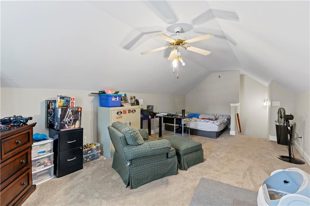 3724 Lexington Court Gainesville, GA 30504 - Photo 24 of 56 a living room with furniture and a chandelier