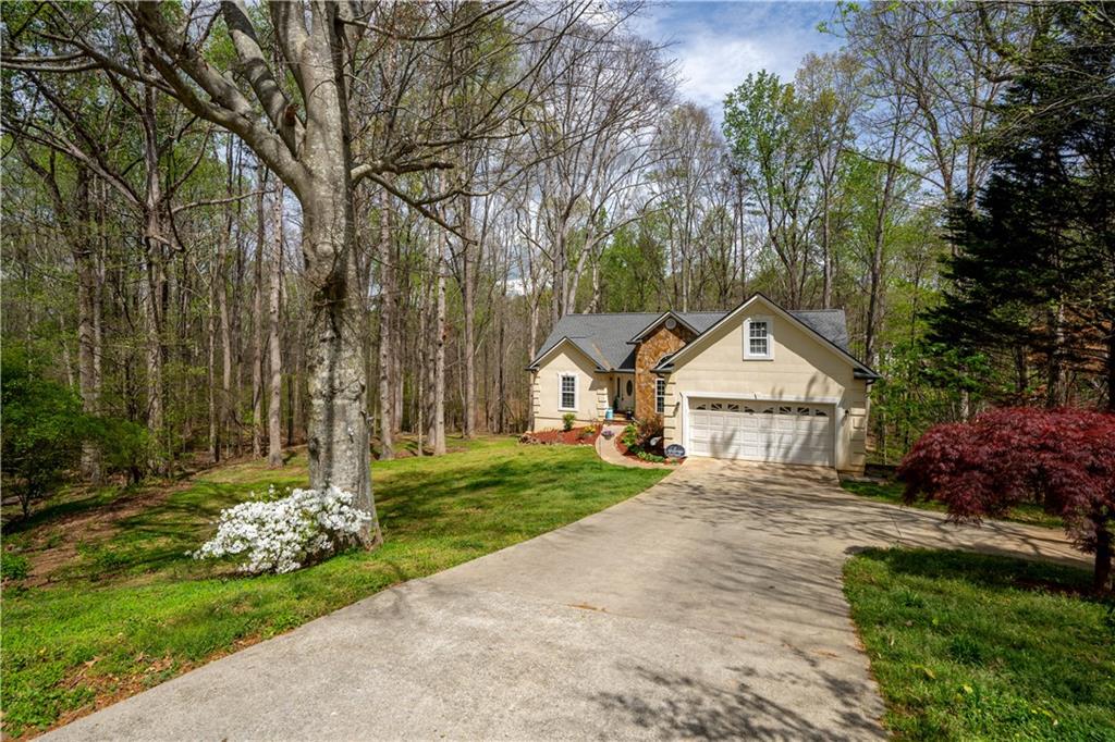 3724 Lexington Court Gainesville, GA 30504 - Photo 42 of 56 a front view of a house with a yard and trees