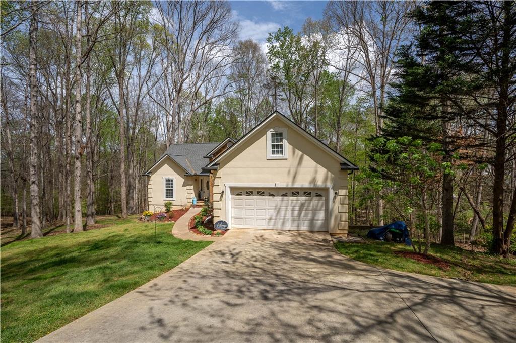 3724 Lexington Court Gainesville, GA 30504 - Photo 50 of 56 a view of a house with a yard and large trees