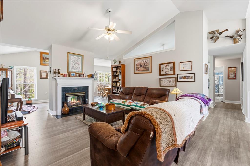 3724 Lexington Court Gainesville, GA 30504 - Photo 5 of 56 a bedroom with a bed and a fireplace