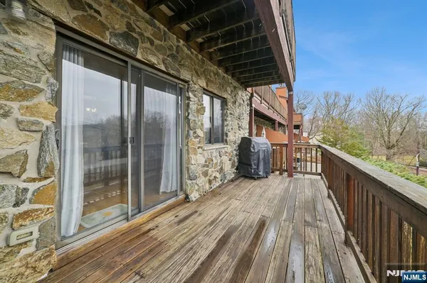 a balcony with wooden floor