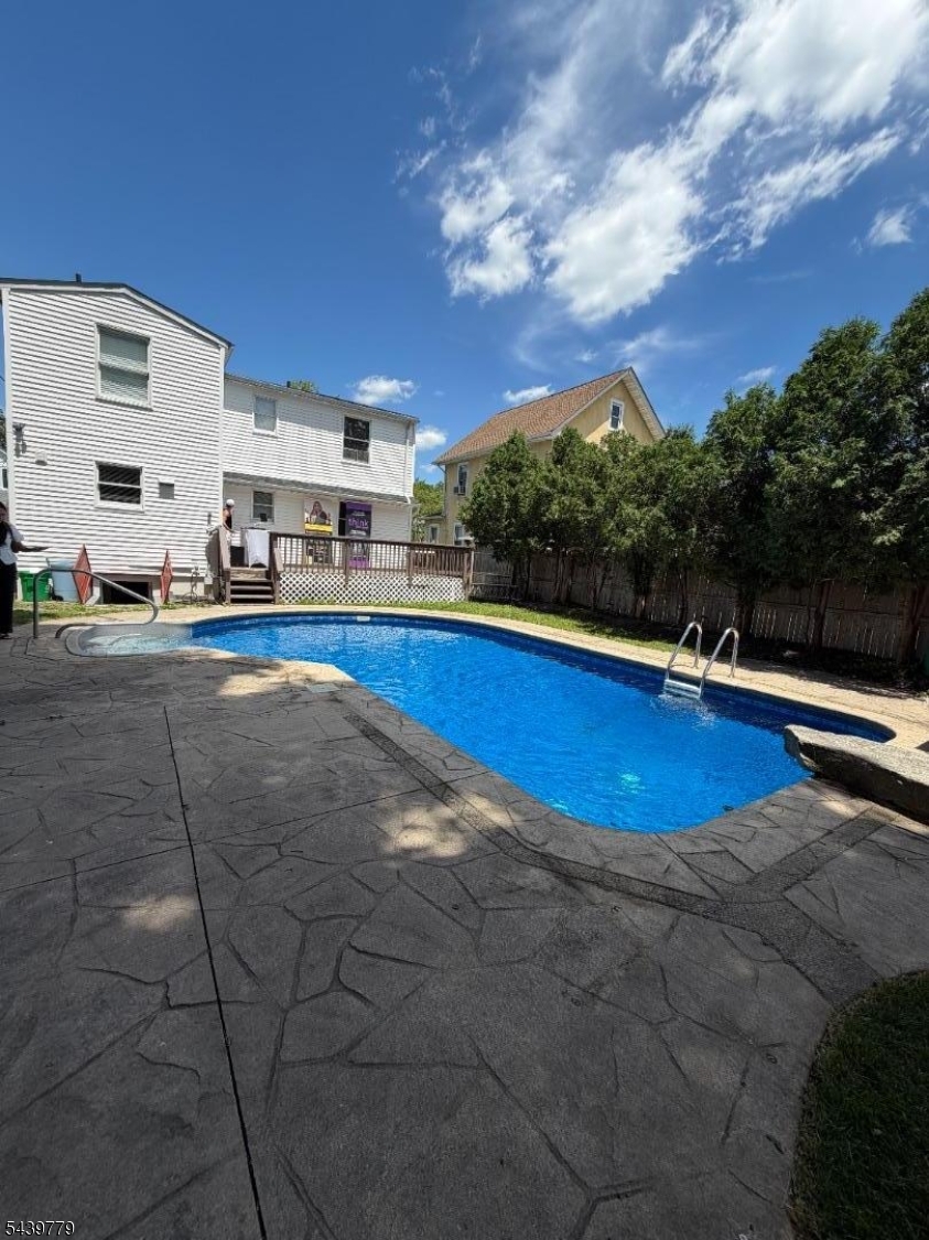 13 1st Street Mahwah, NJ 07430 - Photo 18 of 19 a view of outdoor space with swimming pool and yard