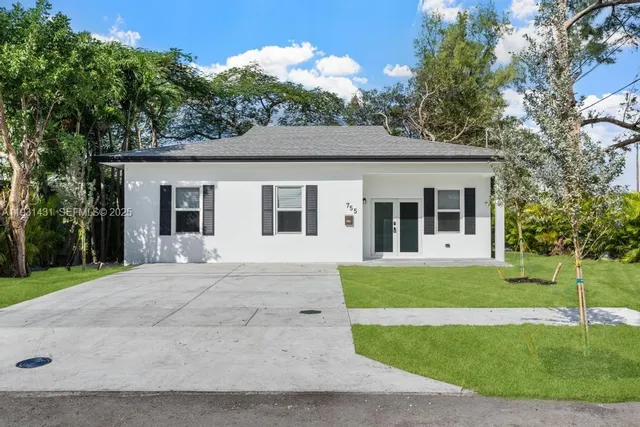 front view of a house with a yard