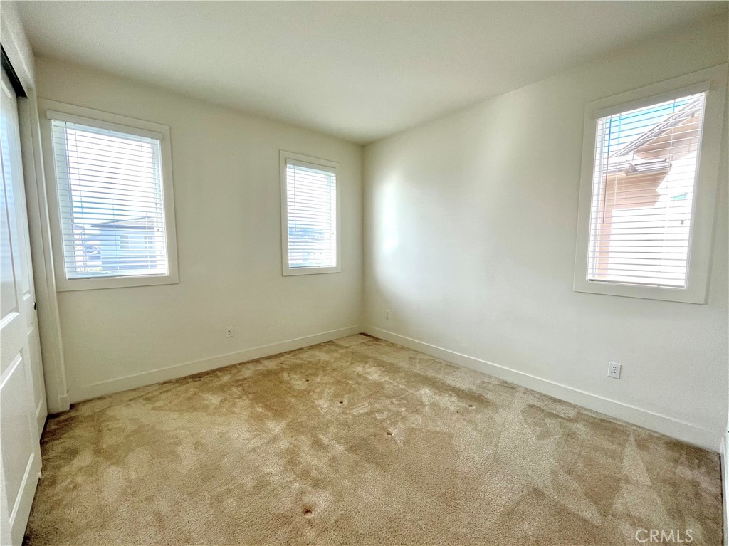 12040 Estrella Place Porter Ranch, CA 91326 - Photo 17 of 25 a view of an empty room and window