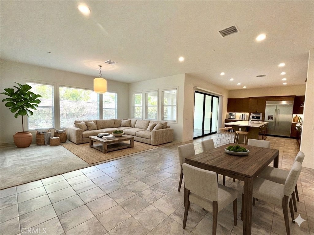12040 Estrella Place Porter Ranch, CA 91326 - Photo 2 of 32 a living room with furniture and a large window
