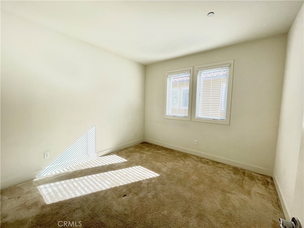 12040 Estrella Place Porter Ranch, CA 91326 - Photo 22 of 25 an empty room with windows