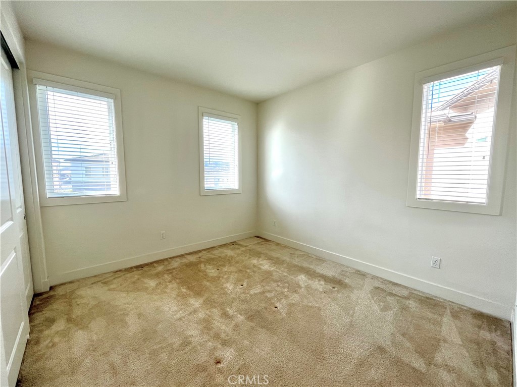 12040 Estrella Place Porter Ranch, CA 91326 - Photo 23 of 32 a view of an empty room and window