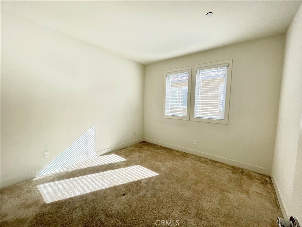 12040 Estrella Place Porter Ranch, CA 91326 - Photo 28 of 32 an empty room with windows