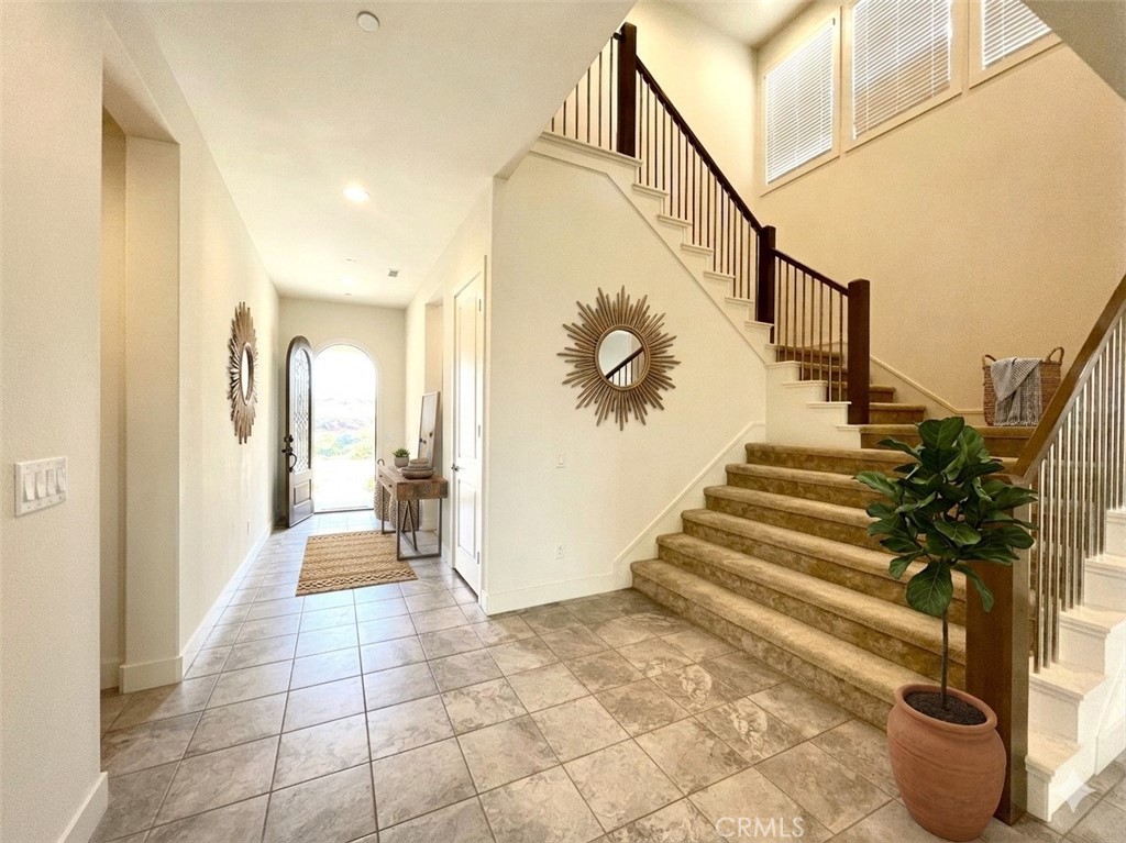 12040 Estrella Place Porter Ranch, CA 91326 - Photo 3 of 32 a view of entryway and hall with wooden floor