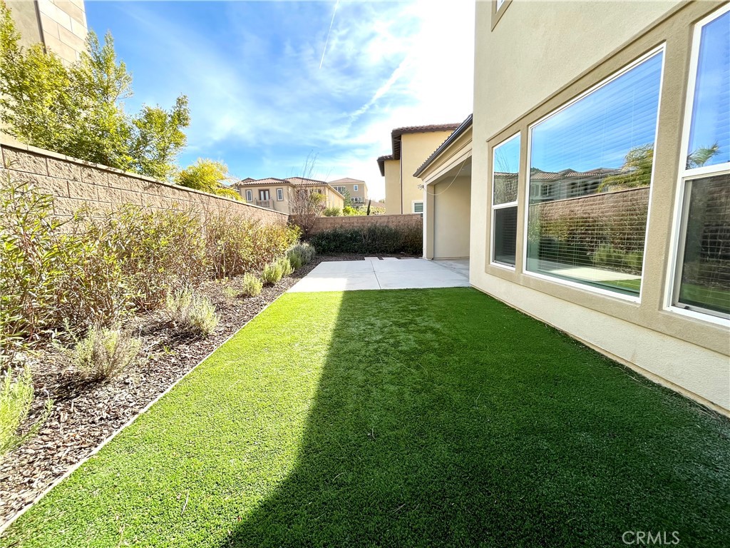 12040 Estrella Place Porter Ranch, CA 91326 - Photo 31 of 32 a view of a back yard of the house