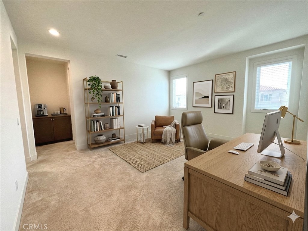 12040 Estrella Place Porter Ranch, CA 91326 - Photo 9 of 32 a view of a livingroom with furniture and a flat screen tv