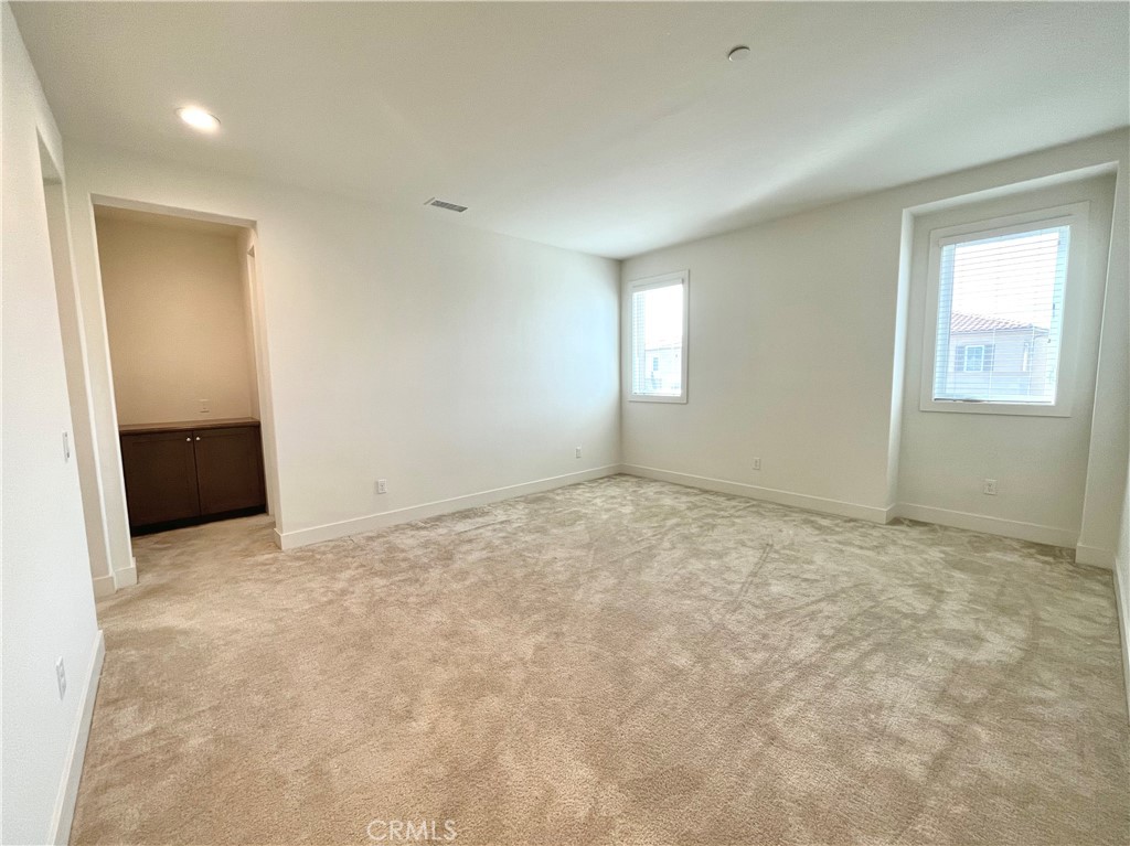 12040 Estrella Place Porter Ranch, CA 91326 - Photo 10 of 25 an empty room with windows