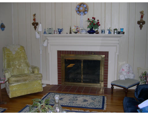 22 Margaret Road Hamilton, MA 01982 - Photo 3 of 3 a living room with furniture and a fireplace