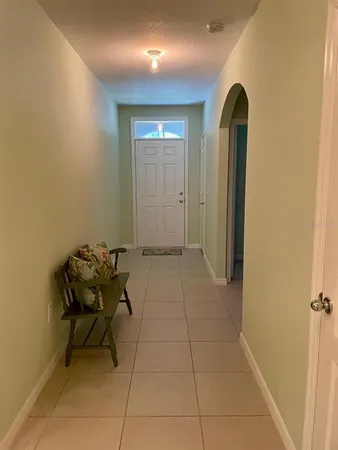 a view of a hallway with seating area