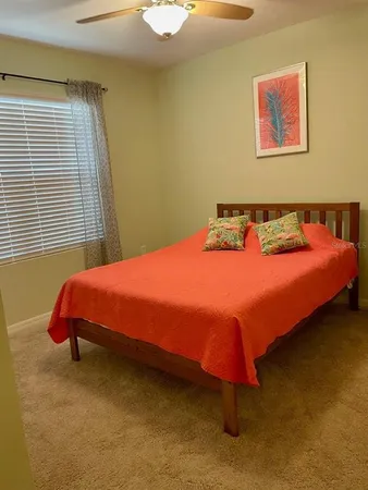 a bedroom with a bed and bathroom