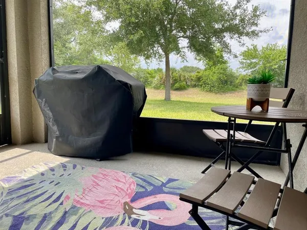 a view of a outdoor space with a table and chairs