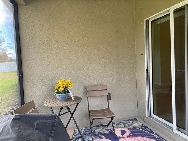 a dining room with furniture and a window