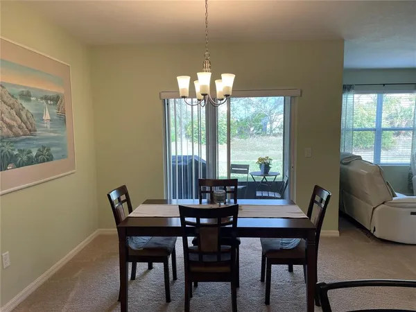 a view of a dining room with furniture window and outside view