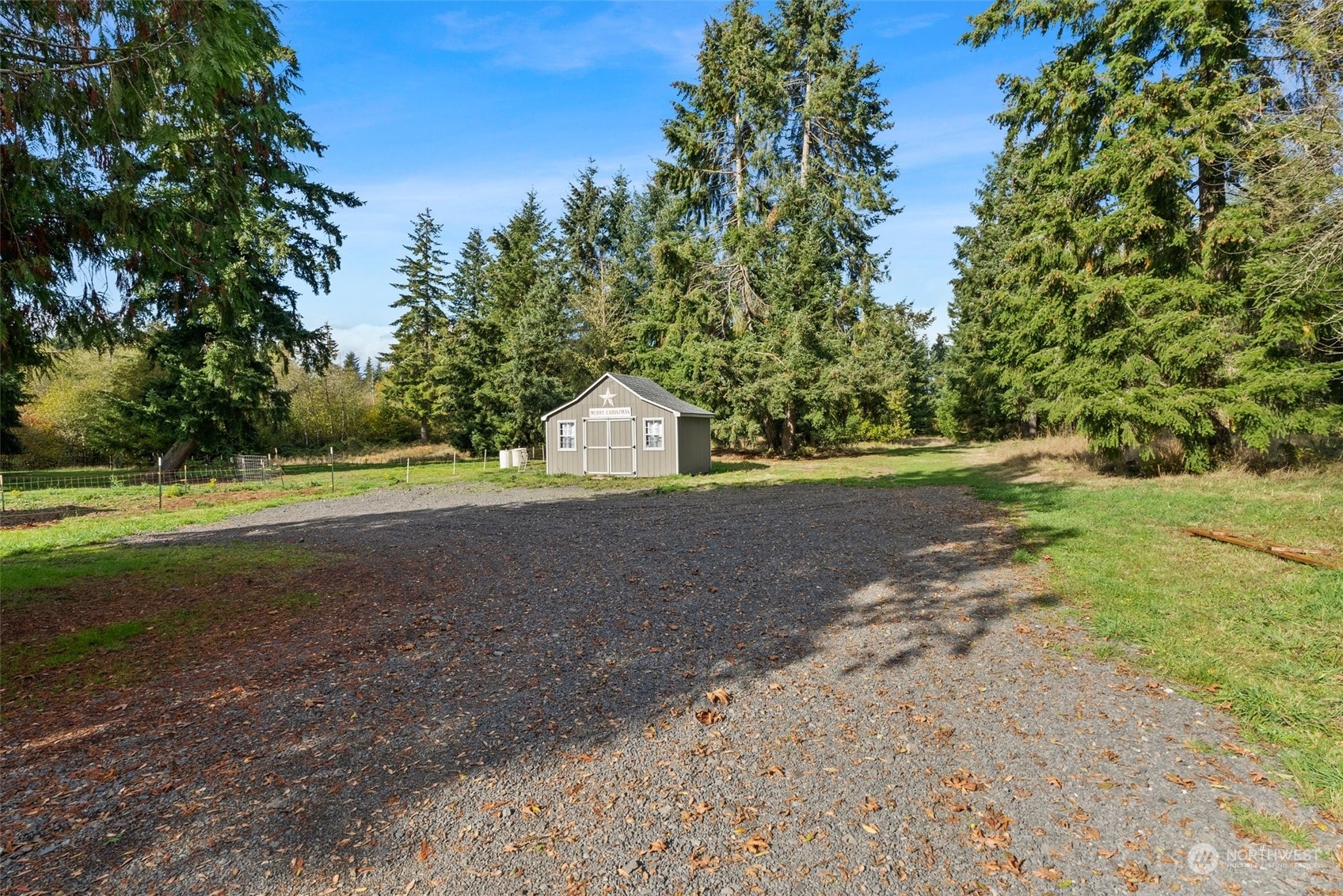 138 Pleasant Valley Road Winlock, WA 98596 - Photo 26 of 34 a view of dirt field with trees around