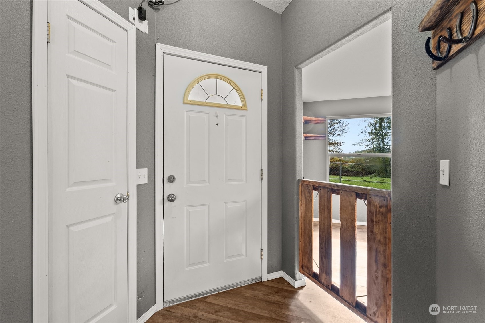 138 Pleasant Valley Road Winlock, WA 98596 - Photo 4 of 34 a view of a bedroom with wooden floor and hallway